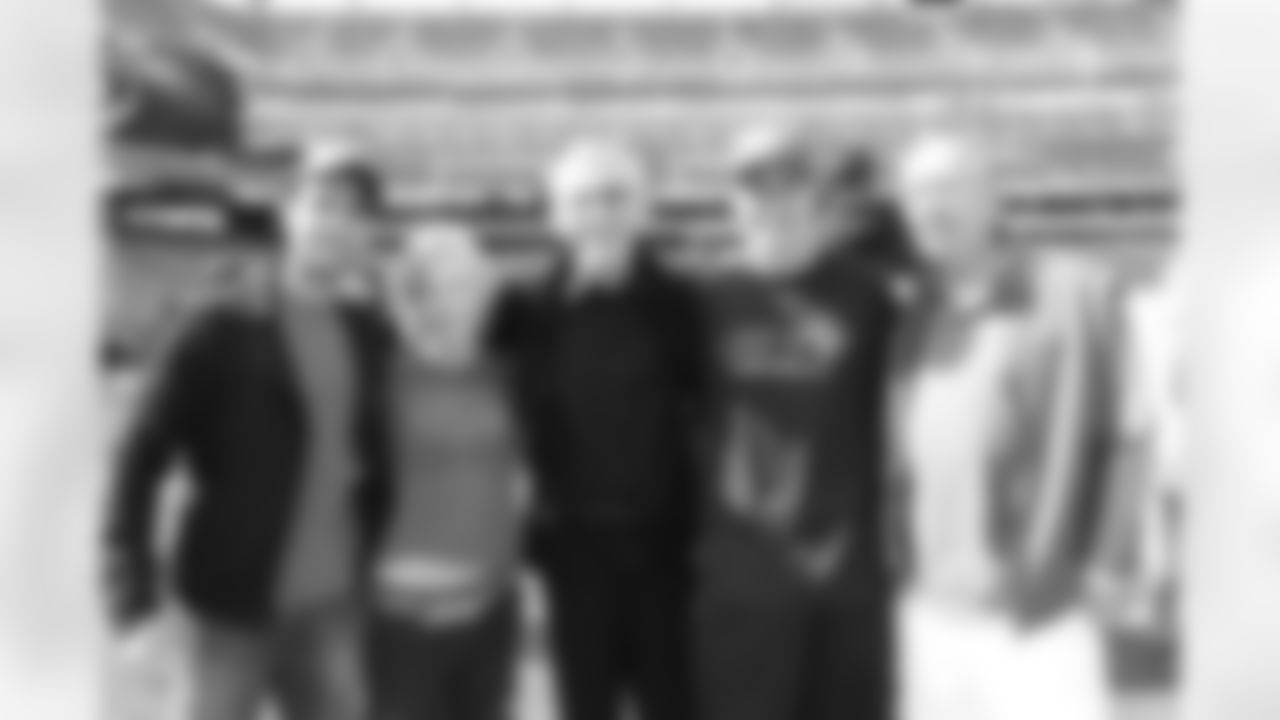 The cast of Law and Order poses on the sideline before the Jets vs 49ers game at MetLife Stadium