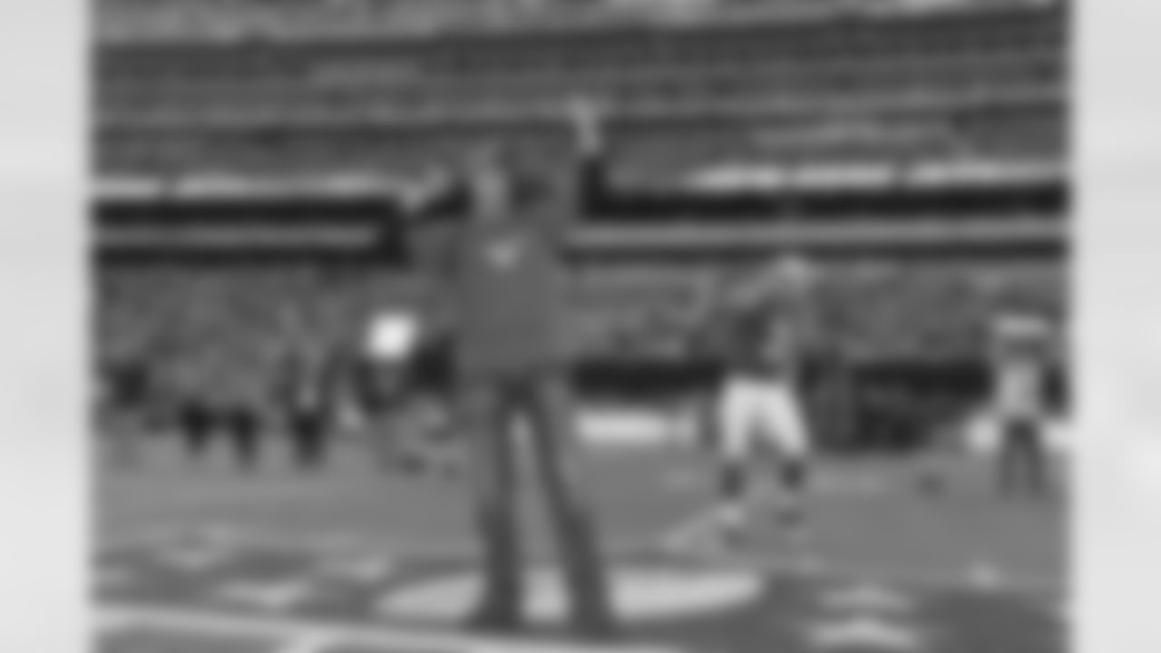 Actor Ralph Macchio leads a J-E-T-S chant before the Jets vs Dolphins game.