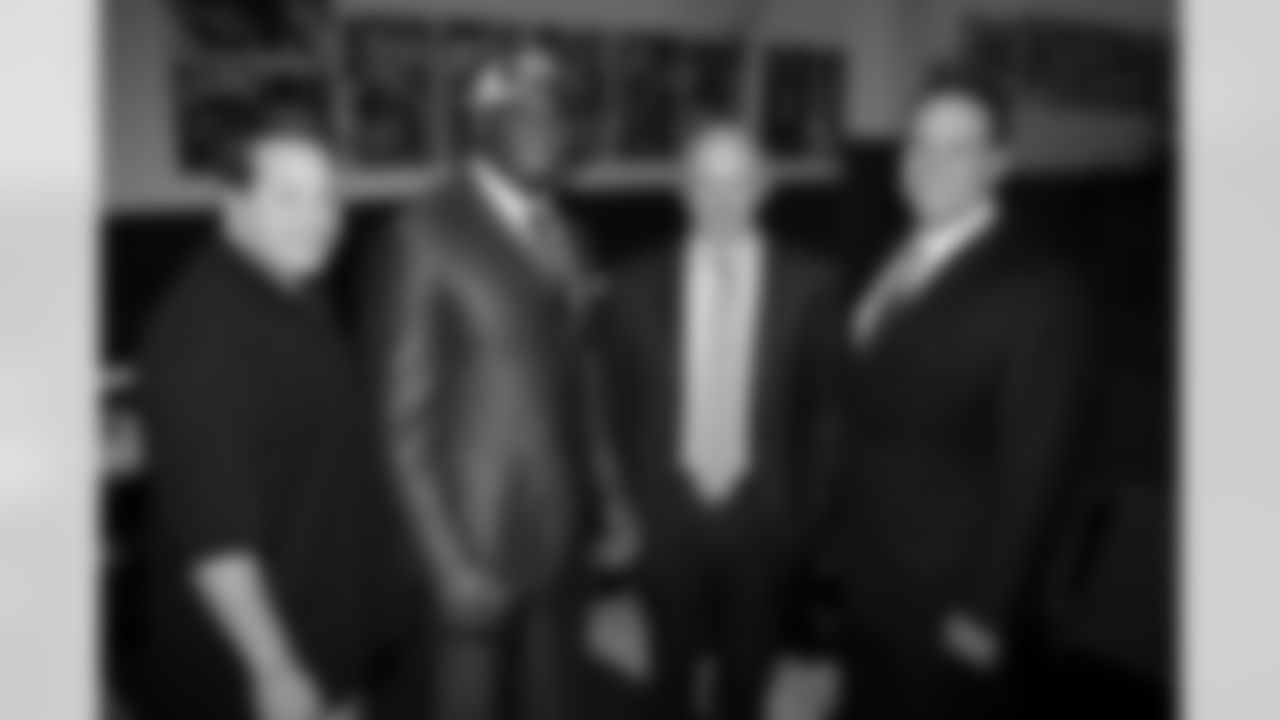 Eric Mangini, Vernon Gholston, Woody Johnson and Mike Tannenbaum