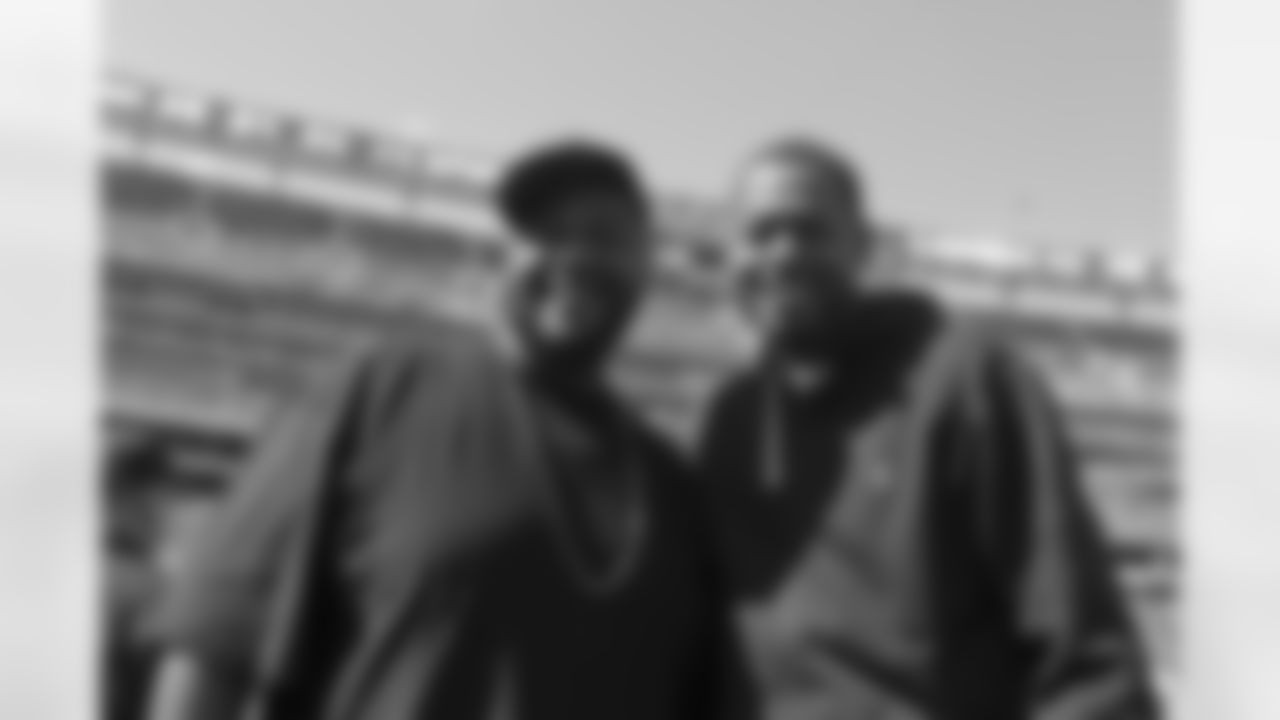 New York Knicks Center Marcus Camby and actor Grizz Chapman on the sideline before the Jets vs 49ers game