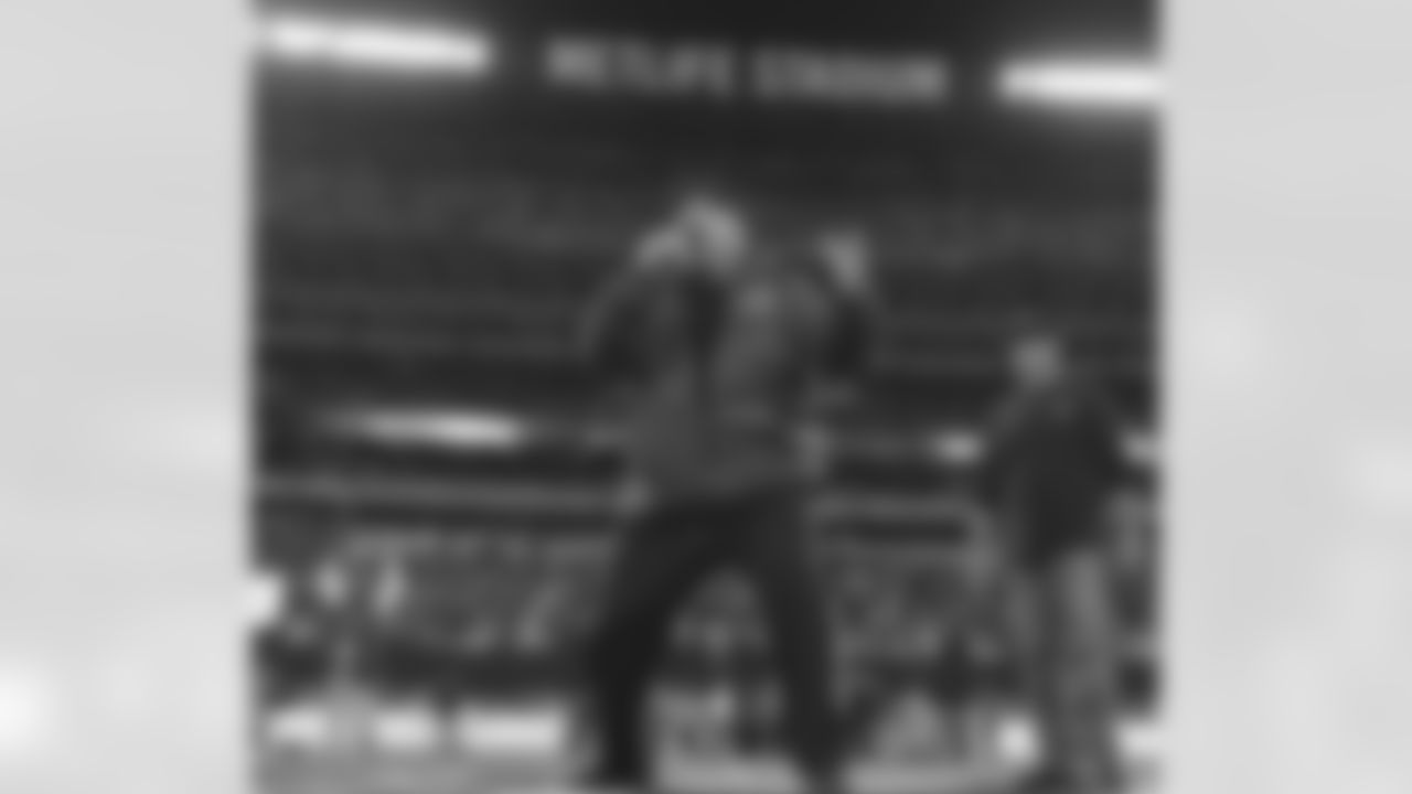 Actor Kevin James leads the J-E-T-S chant before kickoff at the Jets vs Texans game.