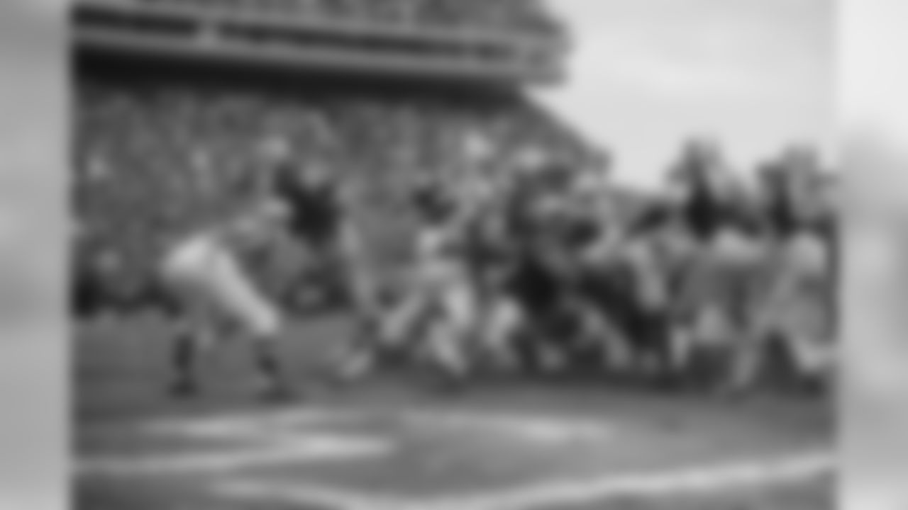 A wall of New York Jets stops the attempted drive of New York Giants running back Tucker Frederickson on the one yard line for no gain. A brawl erupted shortly after the play. Giants went on to win 22-10.