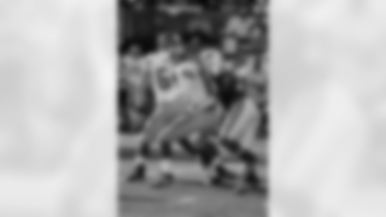David Harris (52) sacks Eli Manning (10) in the first half of play.