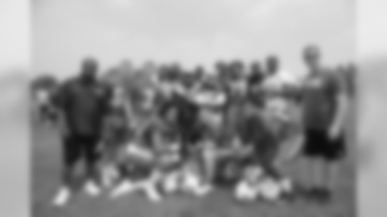 Members of the 2015 New York Jets Rookie Class. Both DL Leonard Williams, a USC product selected No. 6 overall, and QB Bryce Petty, a fourth-rounder from Baylor, take a knee in the middle. Head coach Todd Bowles said Williams is grasping the system quickly while Petty has embraced his pro transition.