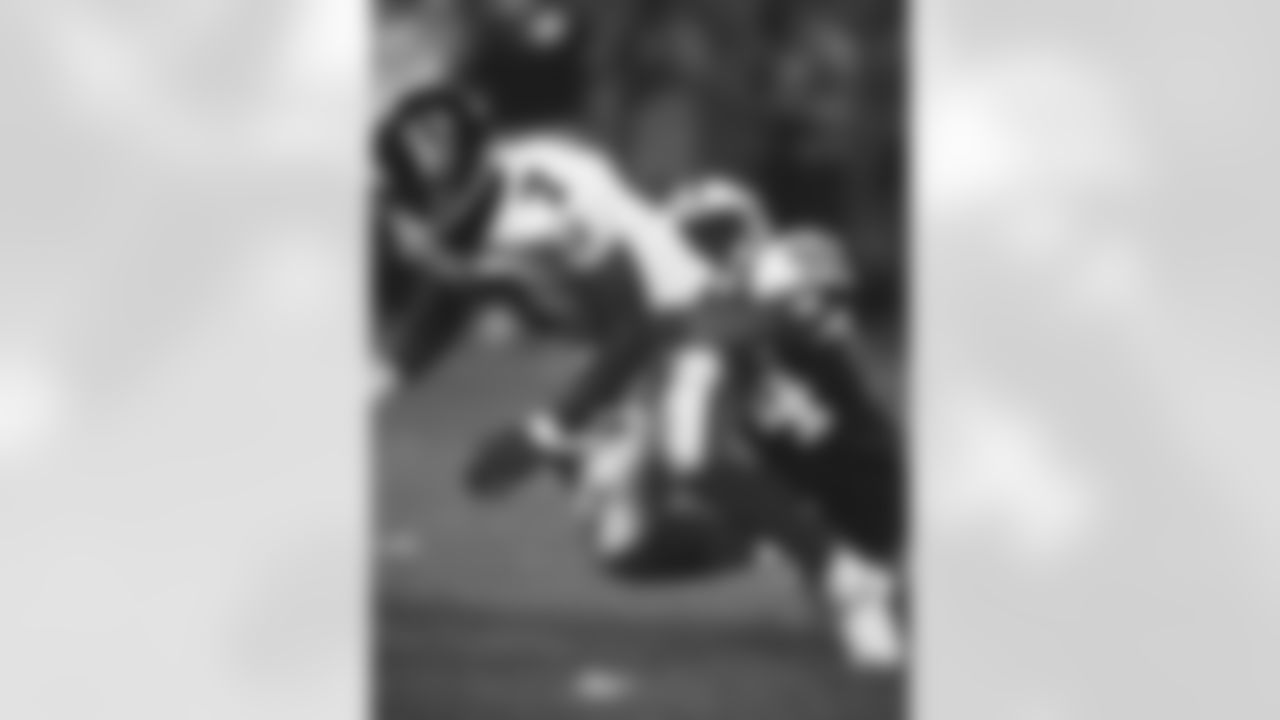 Selected first overall in that year's draft, QB Michael Vick's welcomed into the NFL with a John Abraham sack in a 8/11/01 preseason game.