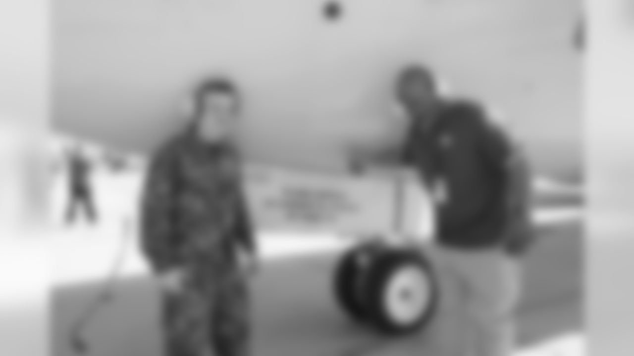 William Henderson posing for a photo with Plane Capt. Robert French from De Pere, WI.