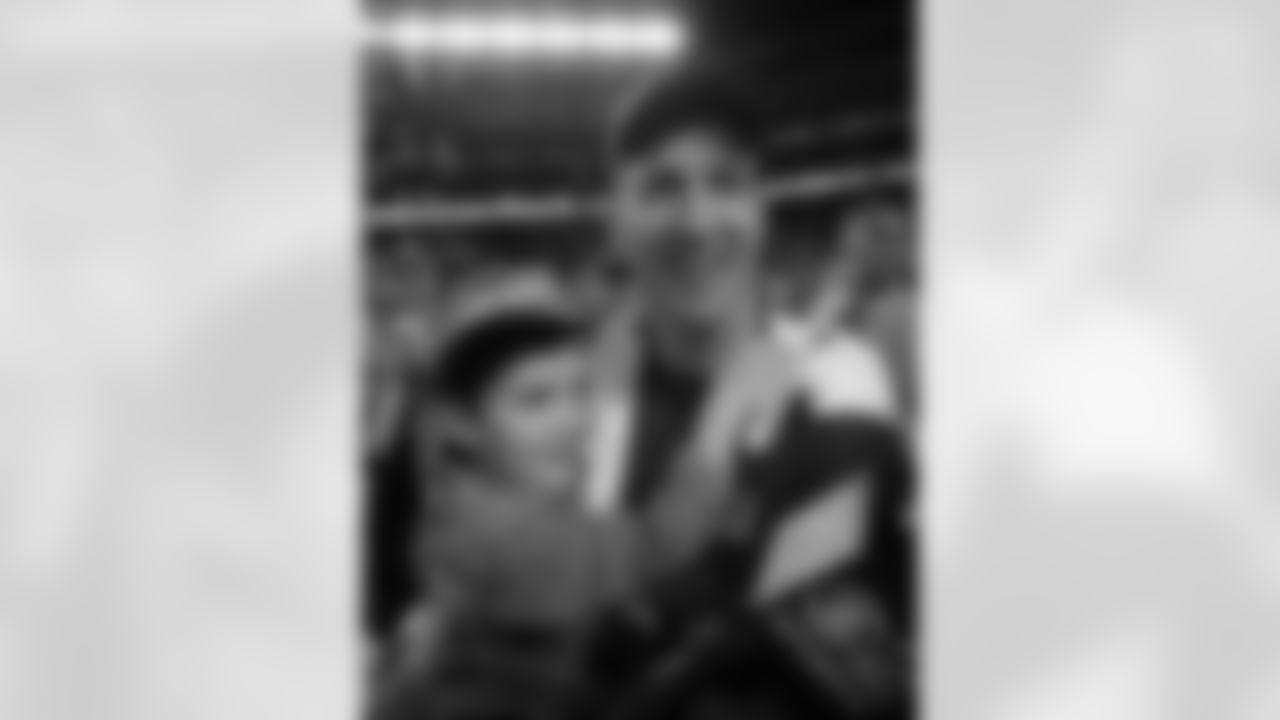 Denver Broncosâ Peyton Manning (18) celebrates with his son, Marshall, after the NFL Super Bowl 50 football game Sunday, Feb. 7, 2016, in Santa Clara, Calif. The Broncos won 24-10. (AP Photo/David J. Phillip)