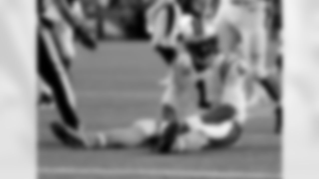 Carolina Panthers quarterback Cam Newton (1) sits on the turf after being hit during the first half of an NFL football game against the Denver Broncos, Thursday, Sept. 8, 2016, in Denver. (AP Photo/Jack Dempsey)