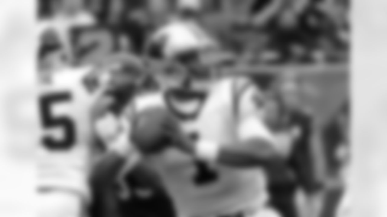Carolina Panthers quarterback Cam Newton looks downfield during the first half of an NFL football game against the Chicago Bears, Sunday, Oct. 22, 2017, in Chicago. (AP Photo/Charles Rex Arbogast)