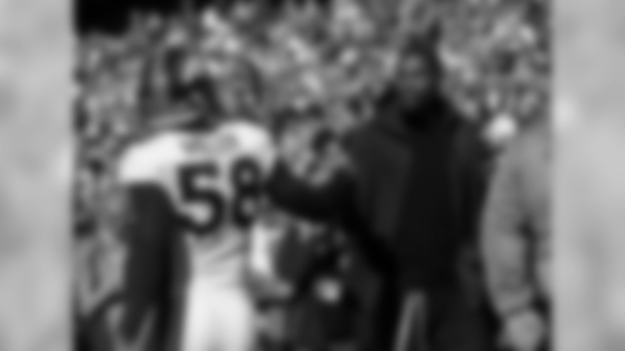 Denver Broncosâ Von Miller (58) greets basketball player Kevin Durant before the NFL Super Bowl 50 football game Sunday, Feb. 7, 2016, in Santa Clara, Calif. (AP Photo/Jeff Chiu)
