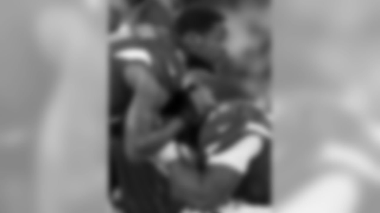 Arizona Cardinals' Patrick Peterson (21) consoles Frostee Rucker during the second half the NFL football NFC Championship game against the Carolina Panthers Sunday, Jan. 24, 2016, in Charlotte, N.C. (AP Photo/Bob Leverone)