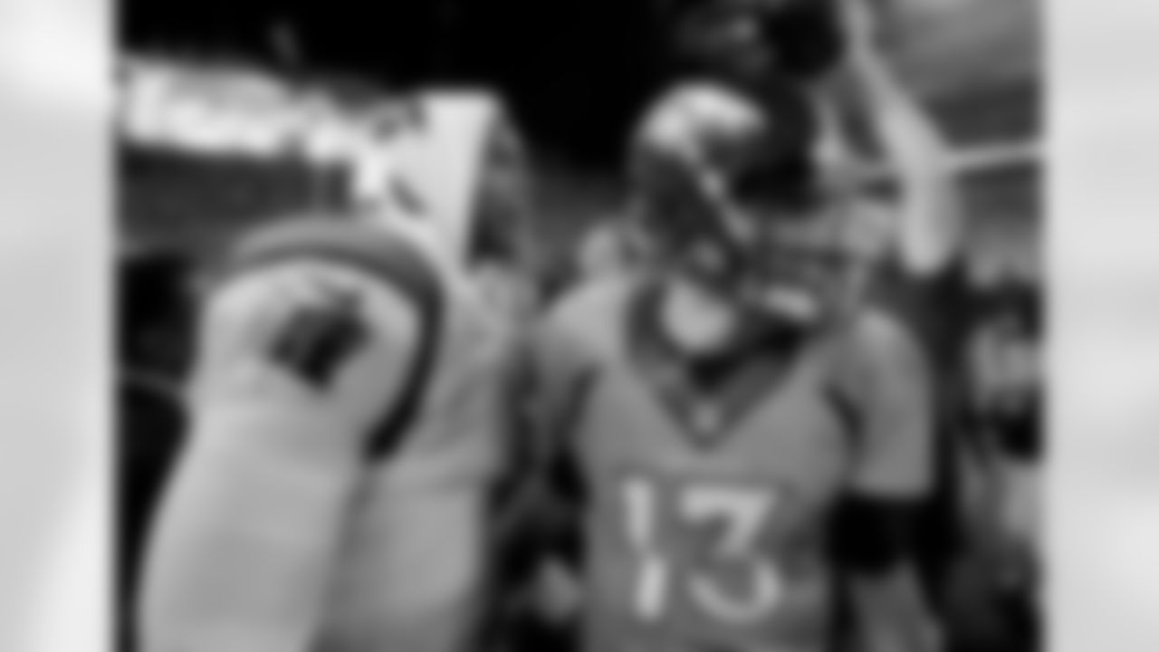 Carolina Panthers quarterback Cam Newton (1) greets Denver Broncos quarterback Trevor Siemian (13) after an NFL football game, Thursday, Sept. 8, 2016, in Denver. The Broncos won 21-20. (AP Photo/Jack Dempsey)