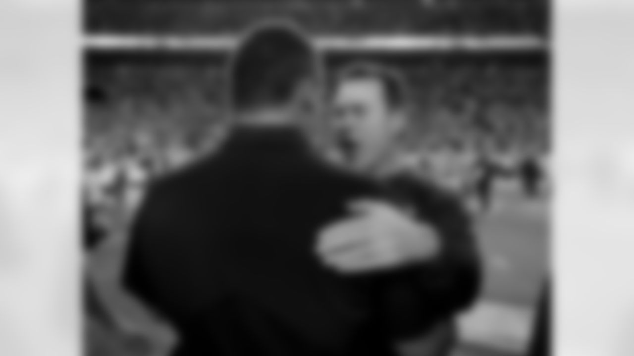Denver Broncos head coach Gary Kubiak embraces Carolina Panthers head coach Ron Rivera after an NFL football game, Thursday, Sept. 8, 2016, in Denver. The Broncos won 21-20. (AP Photo/Joe Mahoney)