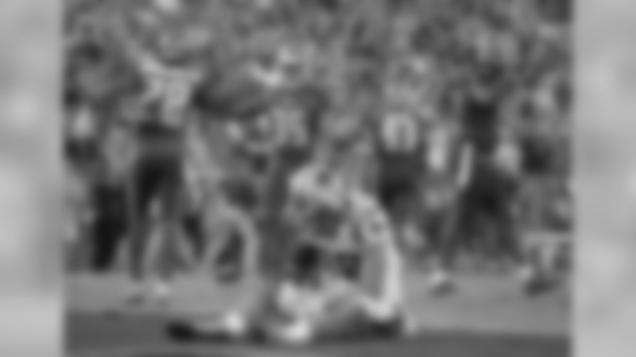 Carolina Panthers tight end Greg Olsen (88) sits dejected in the end zone as the Tampa Bay Buccaneers celebrate after the Panthers failed on a 2-point conversion during the fourth quarter of an NFL football game Sunday, Jan. 1, 2017, in Tampa, Fla. The Buccaneers won the game 17-16. (AP Photo/Phelan M. Ebenhack)
