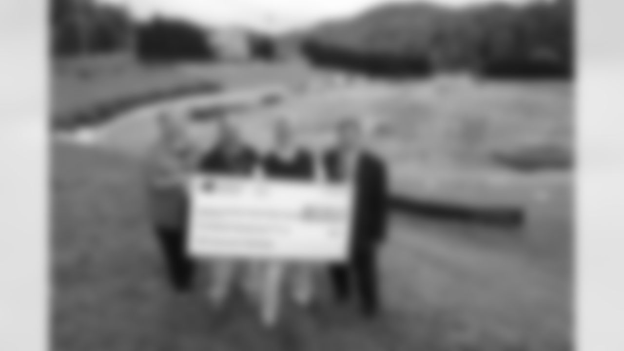 Jackson County officials celebrate the Panthers $200,000 NFL Grassroots grant during initial construction phase of the new field this past spring.