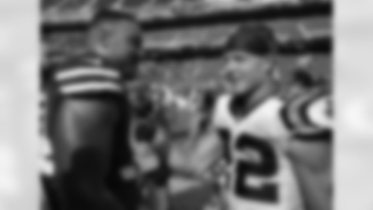 San Francisco 49ers defensive end Solomon Thomas, left, greets Carolina Panthers running back Christian McCaffrey after the Panthers beat the 49ers in an NFL football game in Santa Clara, Calif., Sunday, Sept. 10, 2017. (AP Photo/Tony Avelar)