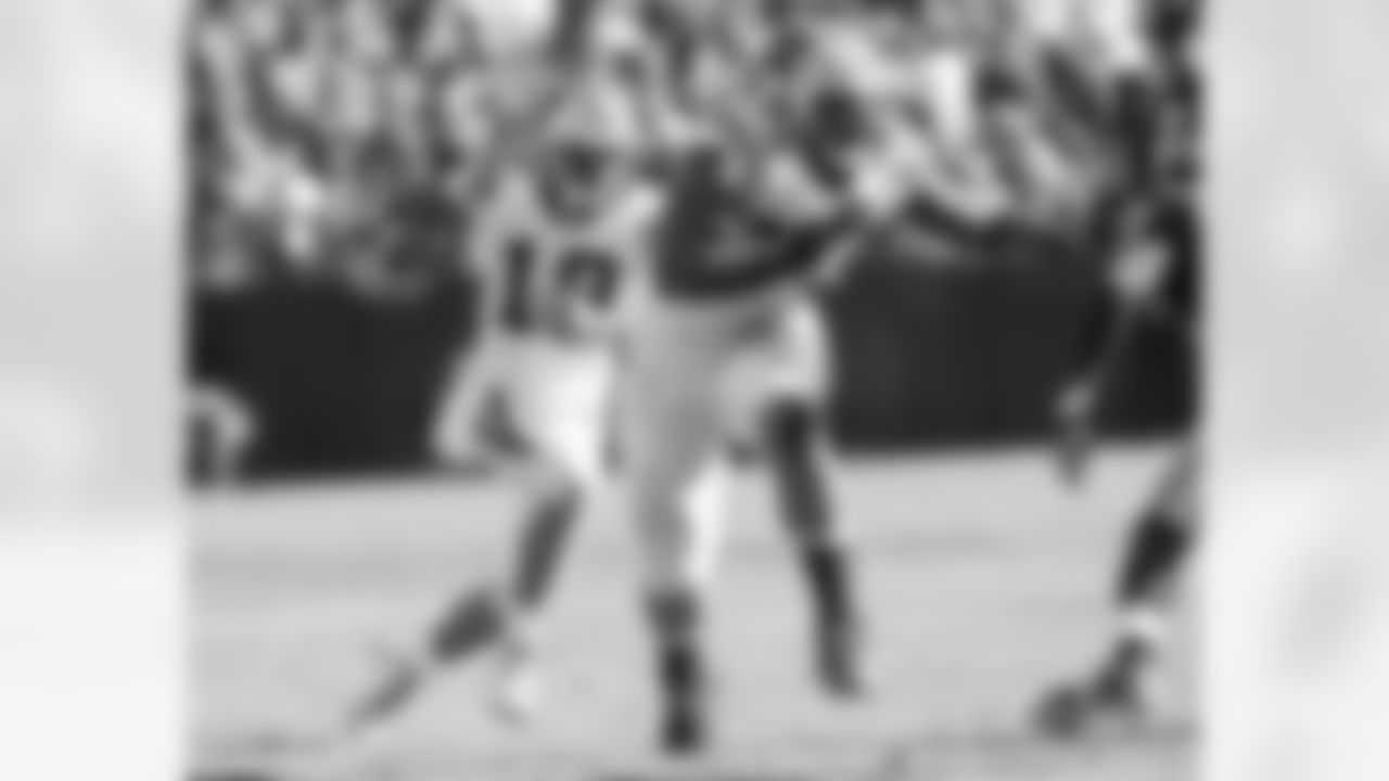 WR Ted Ginn, Jr. and T Michael Oher