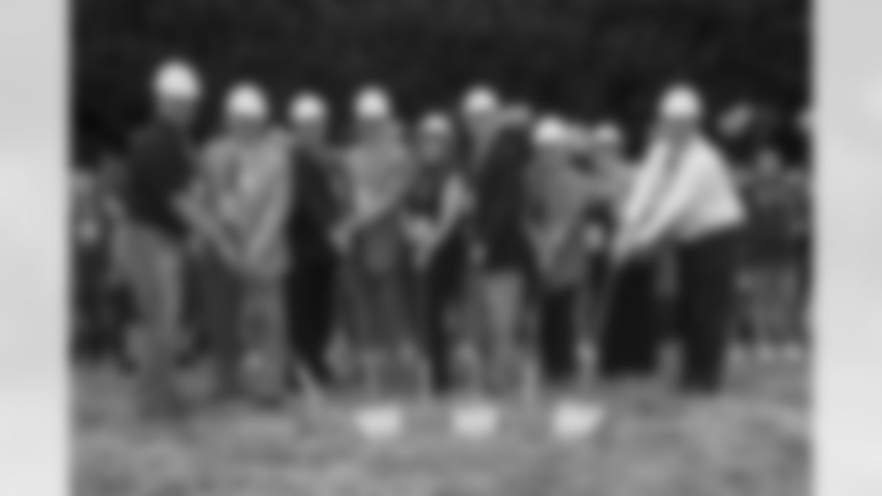 Key project stakeholders prepare for ceremonial groundbreaking.