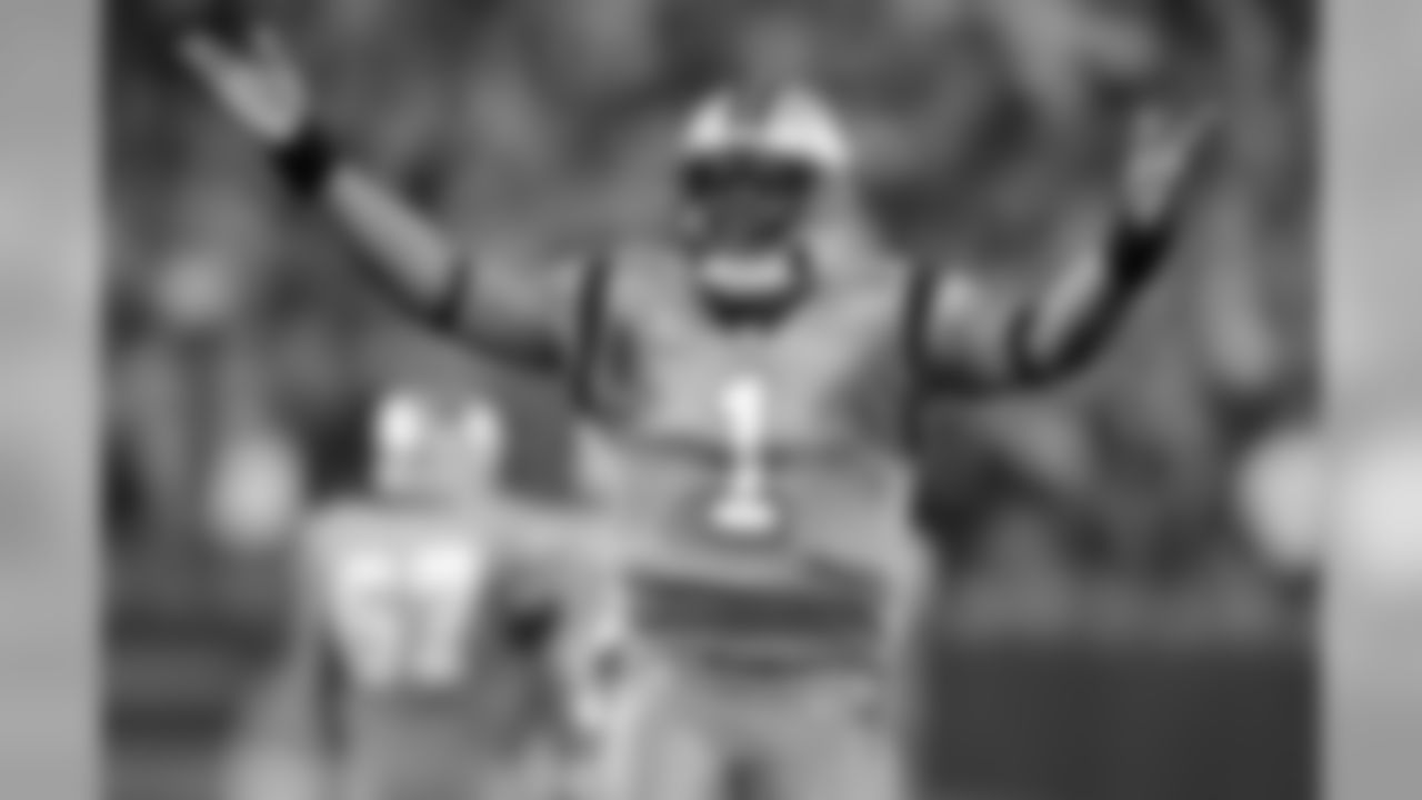 Carolina Panthers' Cam Newton (1) celebrates a touchdown pass against the New Orleans Saints in the first half of an NFL football game in Charlotte, N.C., Thursday, Nov. 17, 2016. (AP Photo/Mike McCarn)