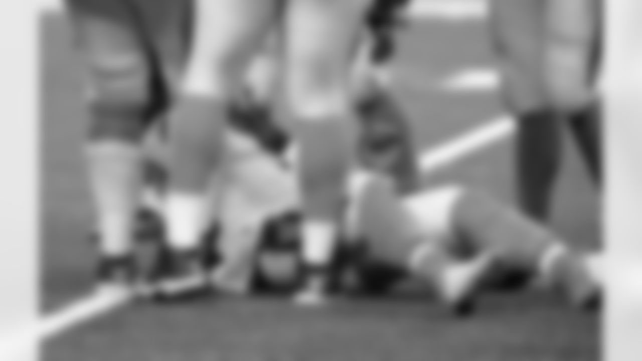 Carolina Panthers quarterback Cam Newton lies on the turf after being sacked in the second half of an NFL football game against the New Orleans Saints in New Orleans, Sunday, Jan. 7, 2018. (AP Photo/Bill Feig)