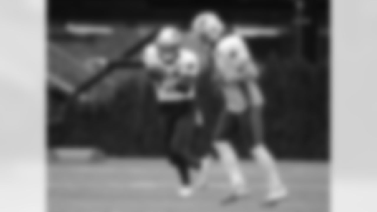 New England Patriots wide receiver Chris Hogan, left, prepares to kick the ball as wide receiver Julian Edelman, right, runs by during NFL football practice, Wednesday, Jan. 4, 2017, in Foxborough, Mass. (AP Photo/Steven Senne)