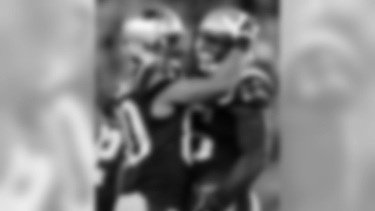 New England Patriots running back Jonas Gray, right, celebrates his 2-point conversion with wide receiver Danny Amendola (80) during the first half of an NFL preseason football game against the Green Bay Packers on Thursday, Aug. 13, 2015, in Foxborough, Mass. (AP Photo/Michael Dwyer)