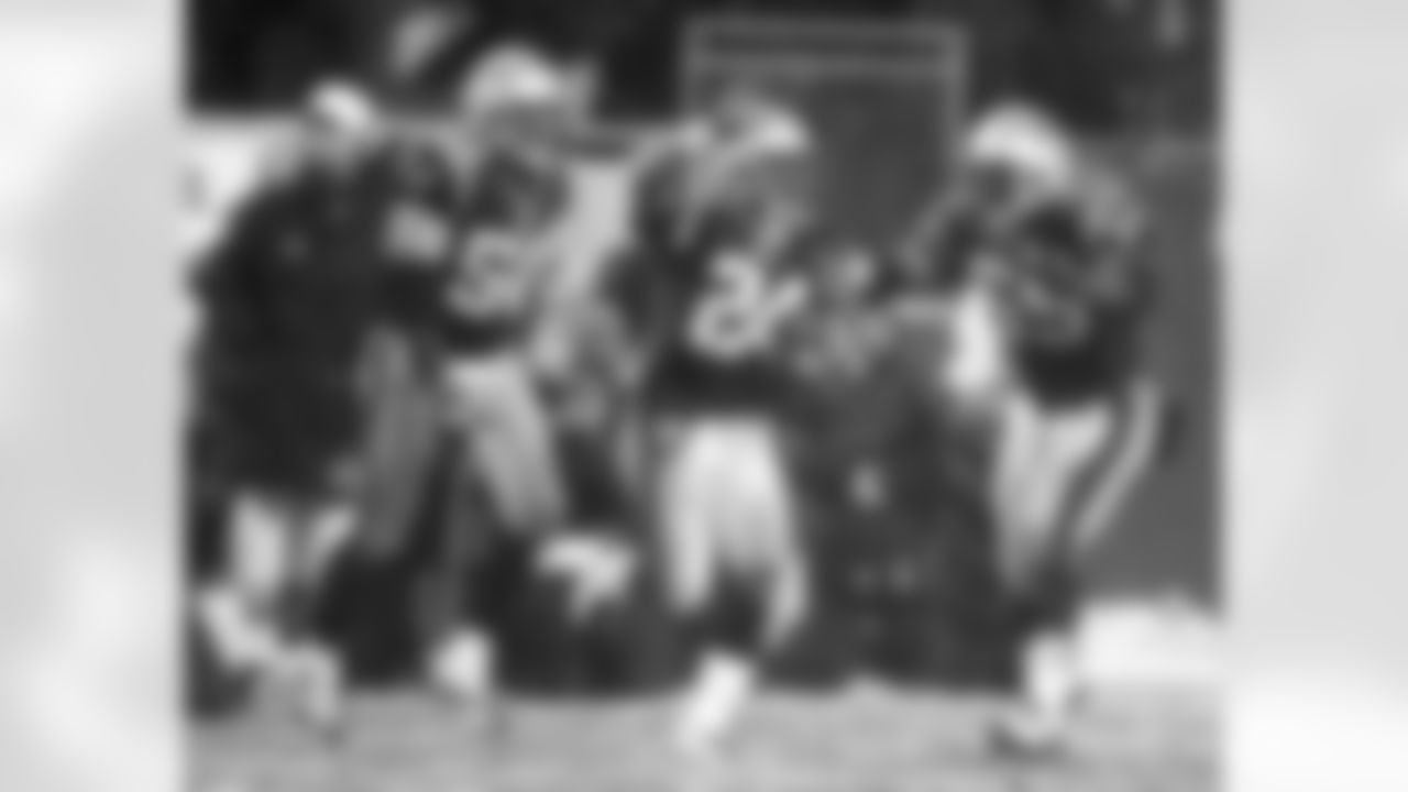Adam Vinatieri kicked five medium-range field goals and the Patriots' stout defense picked off NFL co-MVP Peyton Manning four times in a 24-14 win on Jan. 18, 2004. CB Ty Law had three interceptions, and RB Antwan Smith provided an offensive punch, rushing 22 times for 100 yards.
