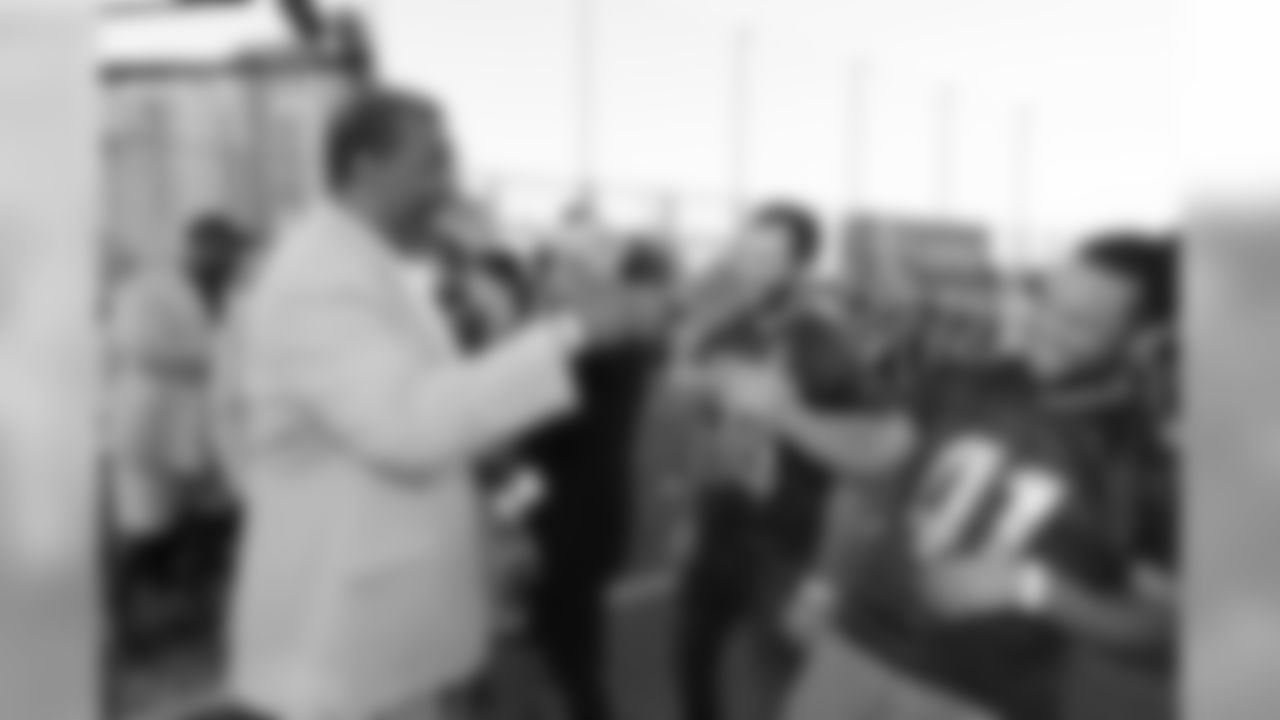 Mean Joe Green greets a member of the Israeli football League.