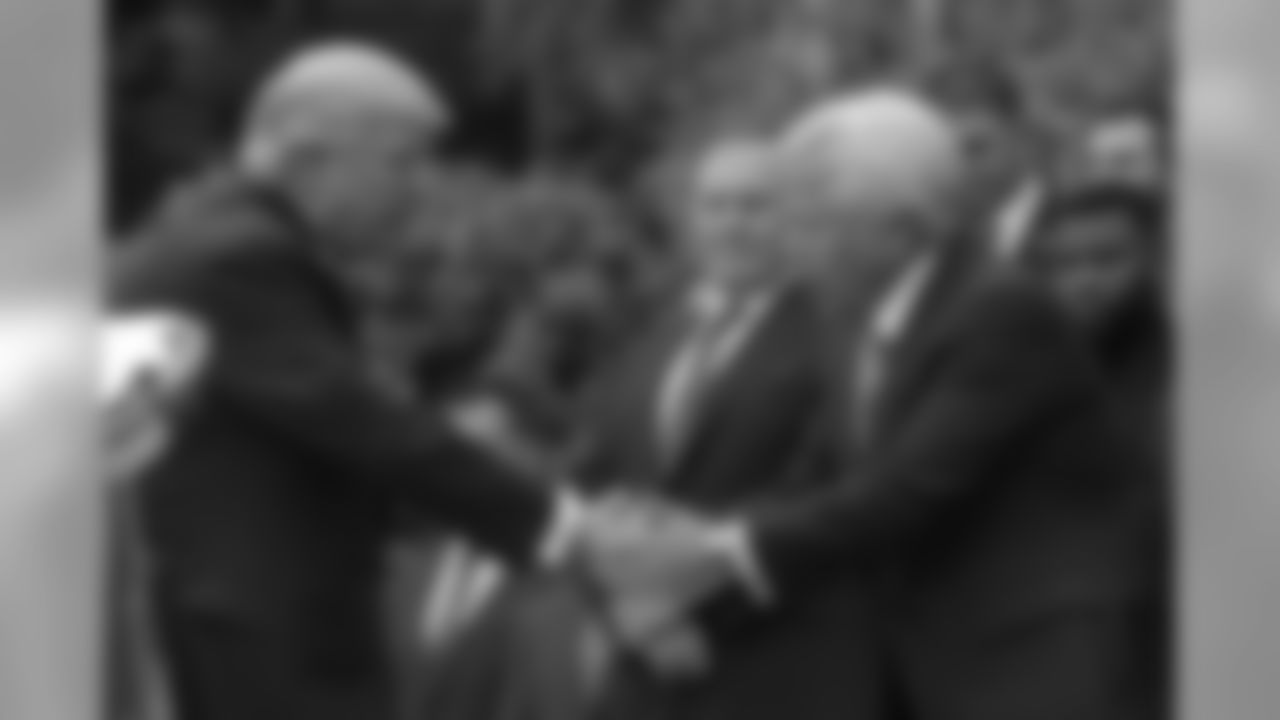 President Donald Trump shakes hands with New England Patriots owner Robert Kraft, accompanied by head coach Bill Belichick, center, during a ceremony on the South Lawn of the White House in Washington, Wednesday, April 19, 2017, where the president honored the Super Bowl Champion New England Patriots for their Super Bowl LI victory.. (AP Photo/Susan Walsh)
