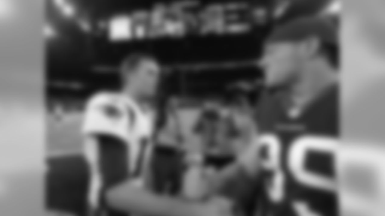 New England Patriots quarterback Tom Brady, left, greets Houston Texans defensive end J.J. Watt, right, following an NFL football preseason game Saturday, Aug. 19, 2017, in Houston. (AP Photo/David J. Phillip)