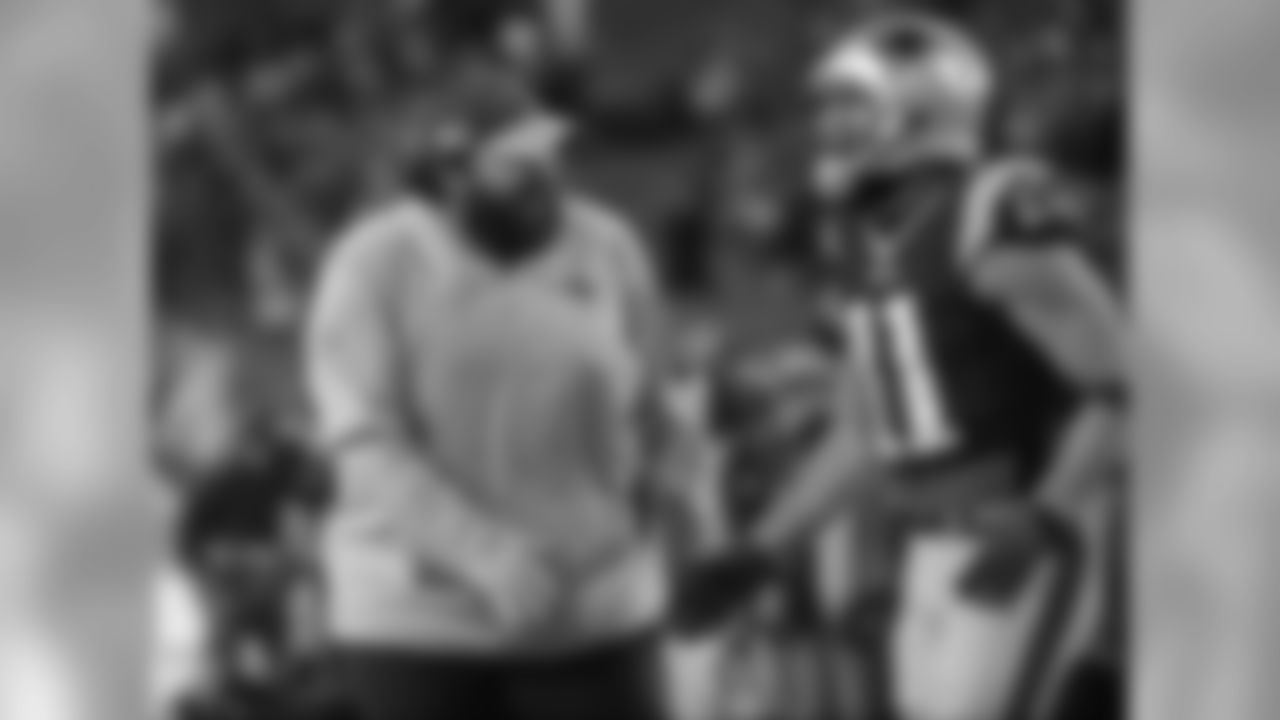 New England Patriots defensive coordinator Matt Patricia speaks with wide receiver Julian Edelman (11) during warm-ups before an NFL divisional playoff football game against the Houston Texans, Saturday, Jan. 14, 2017, in Foxborough, Mass. (AP Photo/Elise Amendola)