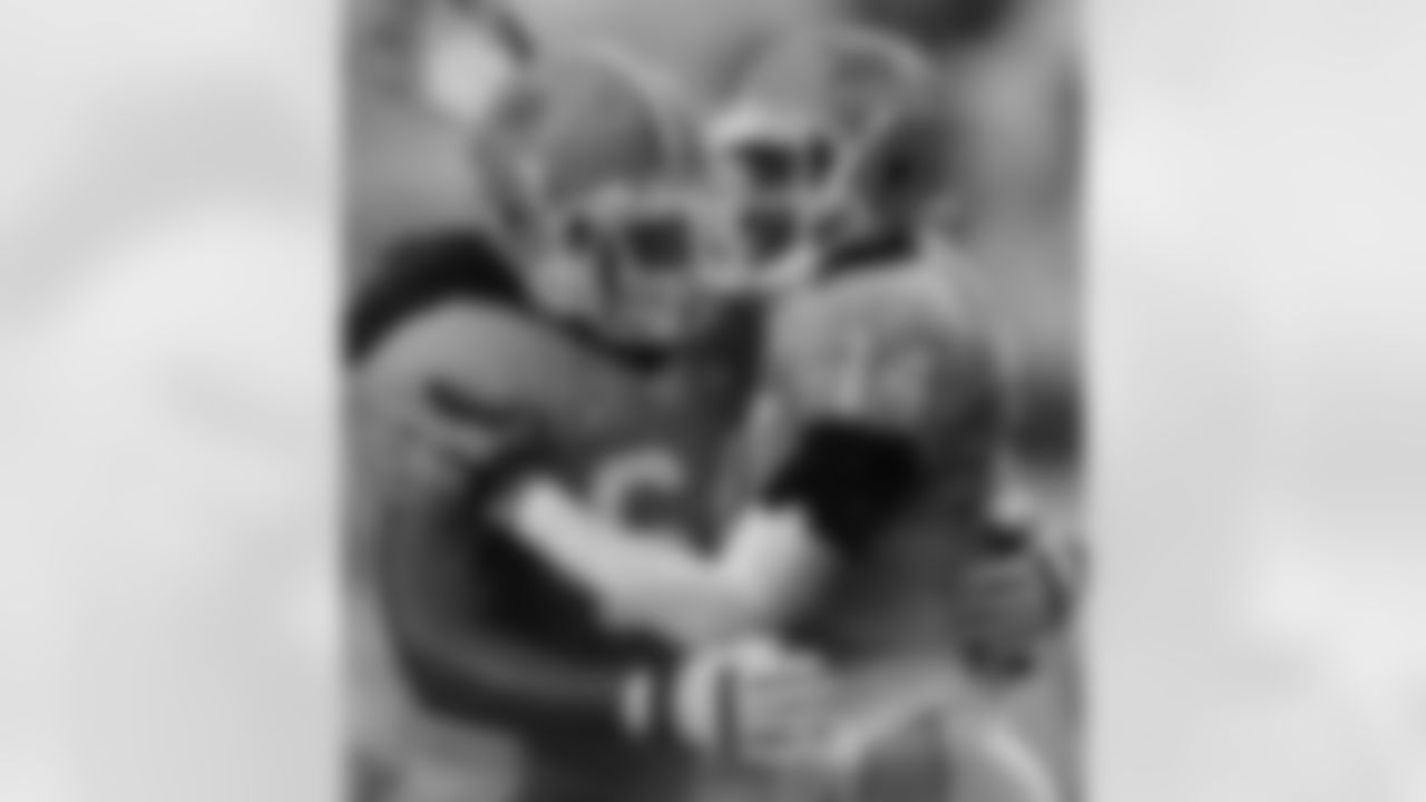 North Carolina's Jonathan Cooper, left, and Quinshad Davis (14) celebrate Davis' touchdown against Idaho during the first half of an NCAA college football game in Chapel Hill, N.C., Saturday, Sept. 29, 2012. (AP Photo/Gerry Broome)