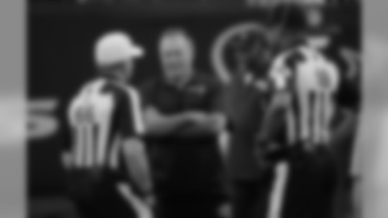 New England Patriots head coach Bill Belichick, center, talks with officials before an NFL football preseason game against the Houston Texans Saturday, Aug. 19, 2017, in Houston. (AP Photo/David J. Phillip)