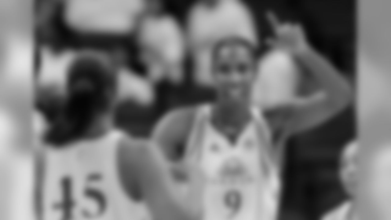 Los Angeles Sparks center Lisa Leslie, right, gestures to teammate Noelle Quinn during Game 1 of a WNBA basketball first-round playoff series against the Seattle Storm on Wednesday, Sept. 16, 2009, in Los Angeles. (AP Photo/Mark J. Terrill)