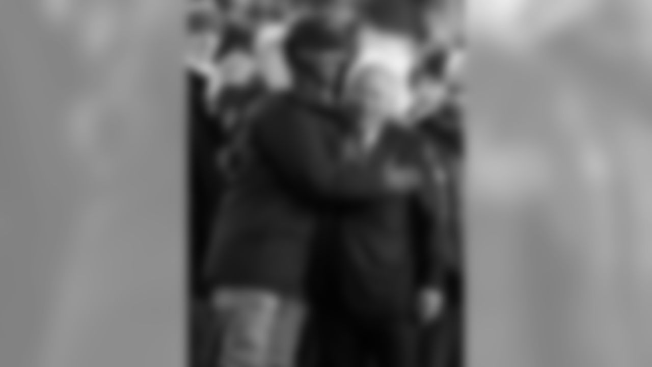 New England Patriots owner Robert Kraft, right, hugs former Patriots defensive back Lawyer Milloy before an NFL football game between the Patriots and the Baltimore Ravens, Monday, Dec. 12, 2016, in Foxborough, Mass. (AP Photo/Charles Krupa)
