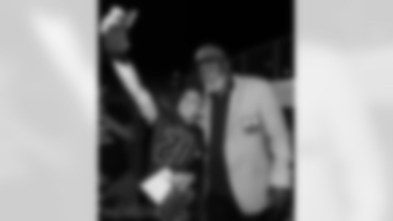 An Israeli Football Leauge player takes a selfie with Jim Brown.