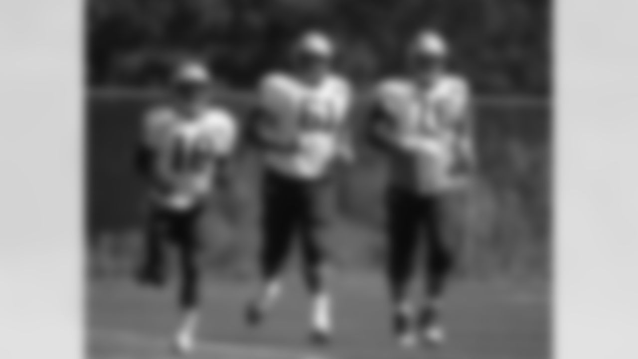 New England Patriots, from the left, wide receiver Matthew Slater, guard Marcus Cannon, and tackle Sebastian Vollmer run while warming up at NFL football practice, Wednesday, Sept. 23, 2015, in Foxborough, Mass. (AP Photo/Steven Senne)