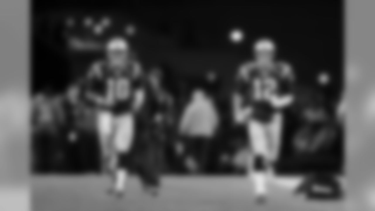 New England Patriots quarterbacks Jimmy Garoppolo, left, and Tom Brady, right, take the field to warm up before an NFL football game against the Baltimore Ravens, Monday, Dec. 12, 2016, in Foxborough, Mass. (AP Photo/Charles Krupa)