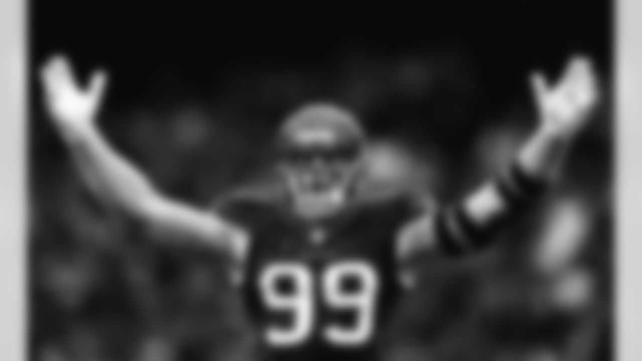 In this photo, altered with an Instagram filter, Houston Texans defensive end J.J. Watt (99) celebrates during an NFL wild card playoff football game against the Kansas City Chiefs on Saturday, Jan. 9, 2016, in Houston. Kansas City won 30-0. (Aaron M. Sprecher via AP)