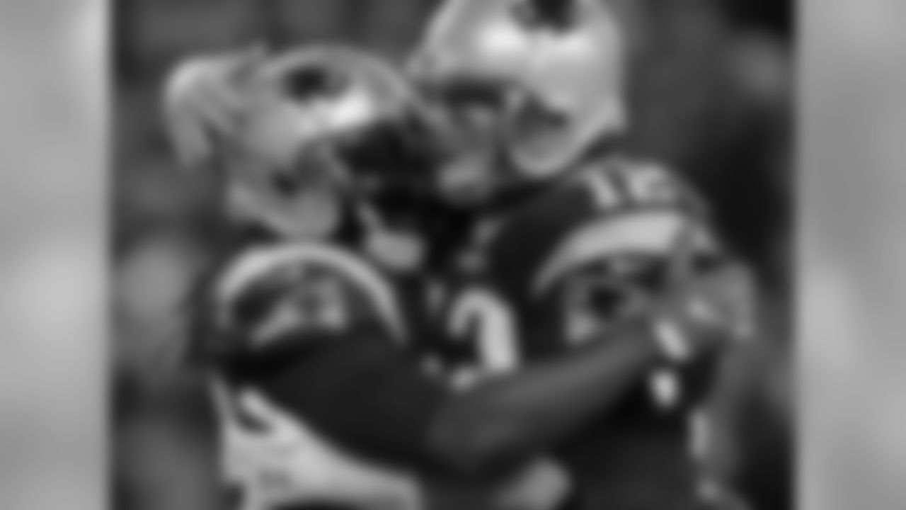 New England Patriots running back LeGarrette Blount, left, celebrates his touchdown run with quarterback Tom Brady during the first half of an NFL football game against the Baltimore Ravens, Monday, Dec. 12, 2016, in Foxborough, Mass. (AP Photo/Charles Krupa)