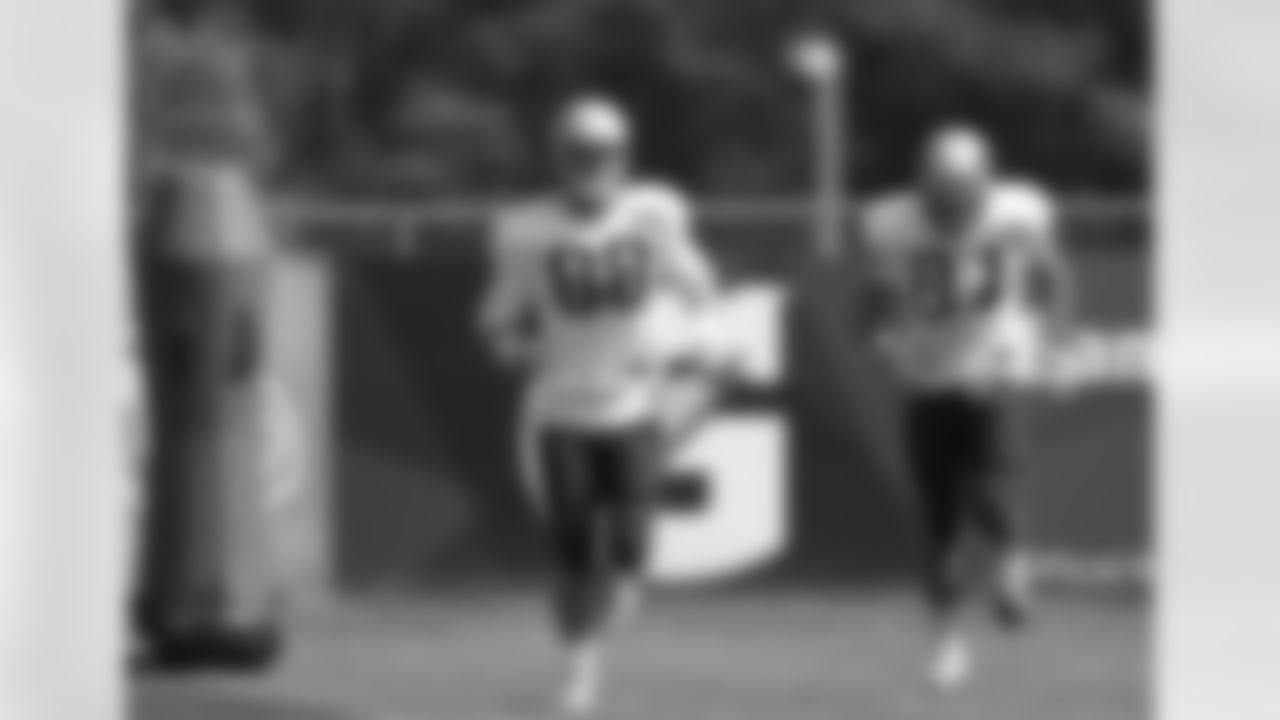 New England Patriots tight end Scott Chandler, left, and tight end Rob Gronkowski, right, warm up on the field during an NFL football practice, Wednesday, Sept. 16, 2015, in Foxborough, Mass. (AP Photo/Steven Senne)
