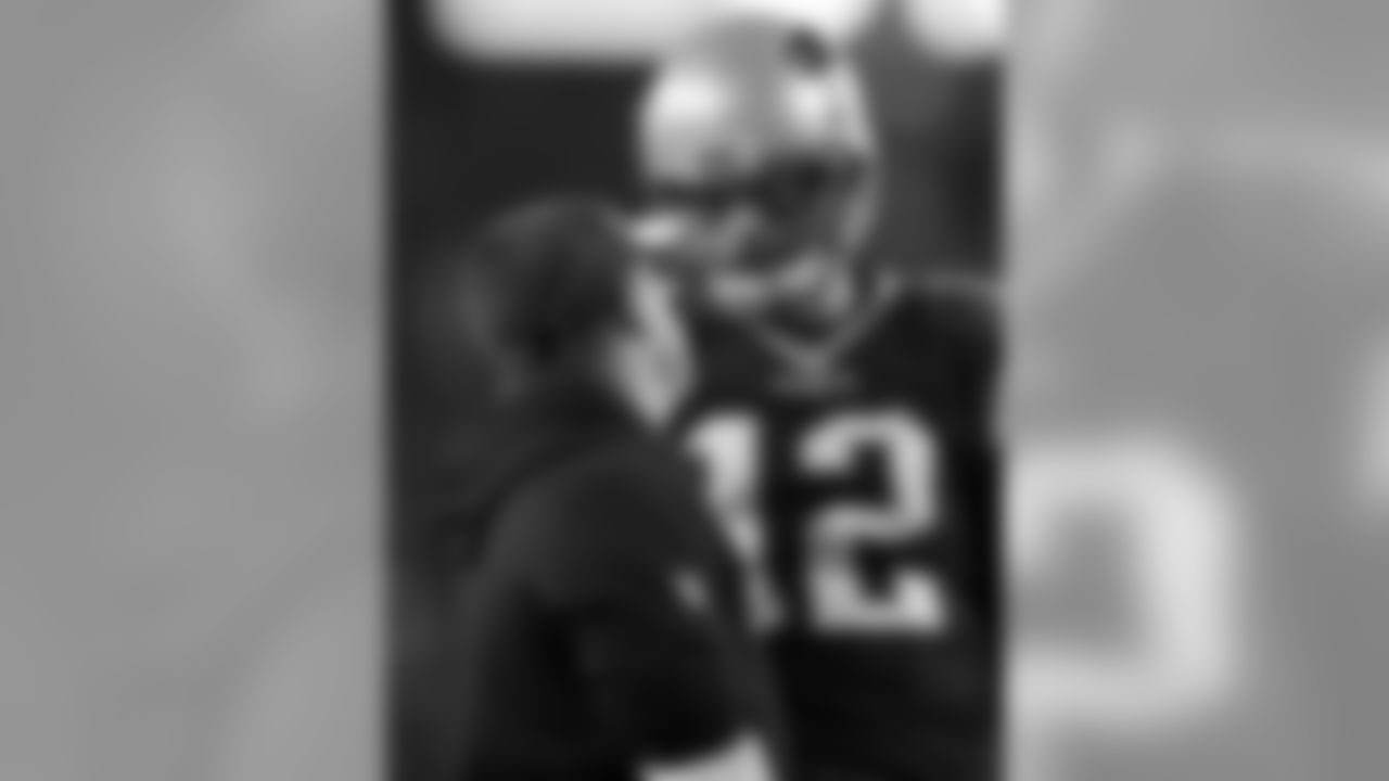 New England Patriots offensive coordinator Josh McDaniels, left, talks to quarterback Tom Brady before an NFL football game against the Baltimore Ravens, Monday, Dec. 12, 2016, in Foxborough, Mass. (AP Photo/Charles Krupa)