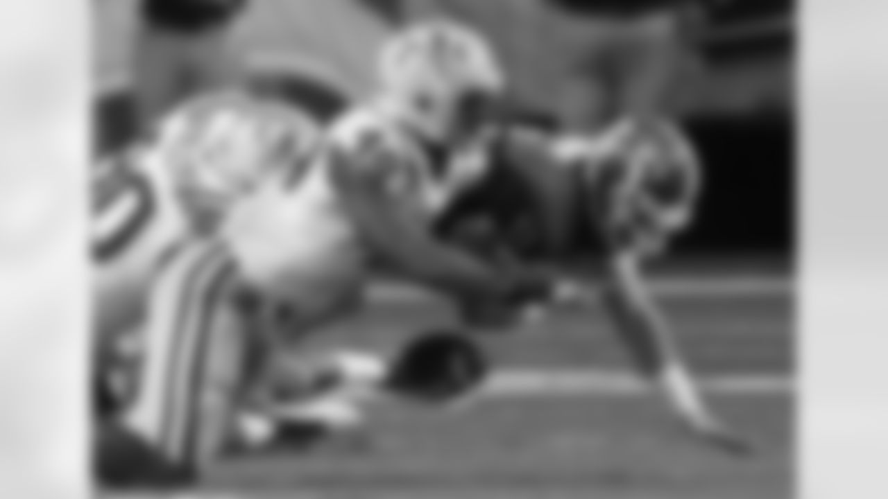 Georgia quarterback Aaron Murray (11) fumbles the ball as LSU defensive end Barkevious Mingo (49) and defensive tackle Michael Brockers (90) defend during the second half of the Southeastern Conference championship NCAA college football game, Saturday, Dec. 3, 2011, in Atlanta. (AP Photo/John Bazemore)