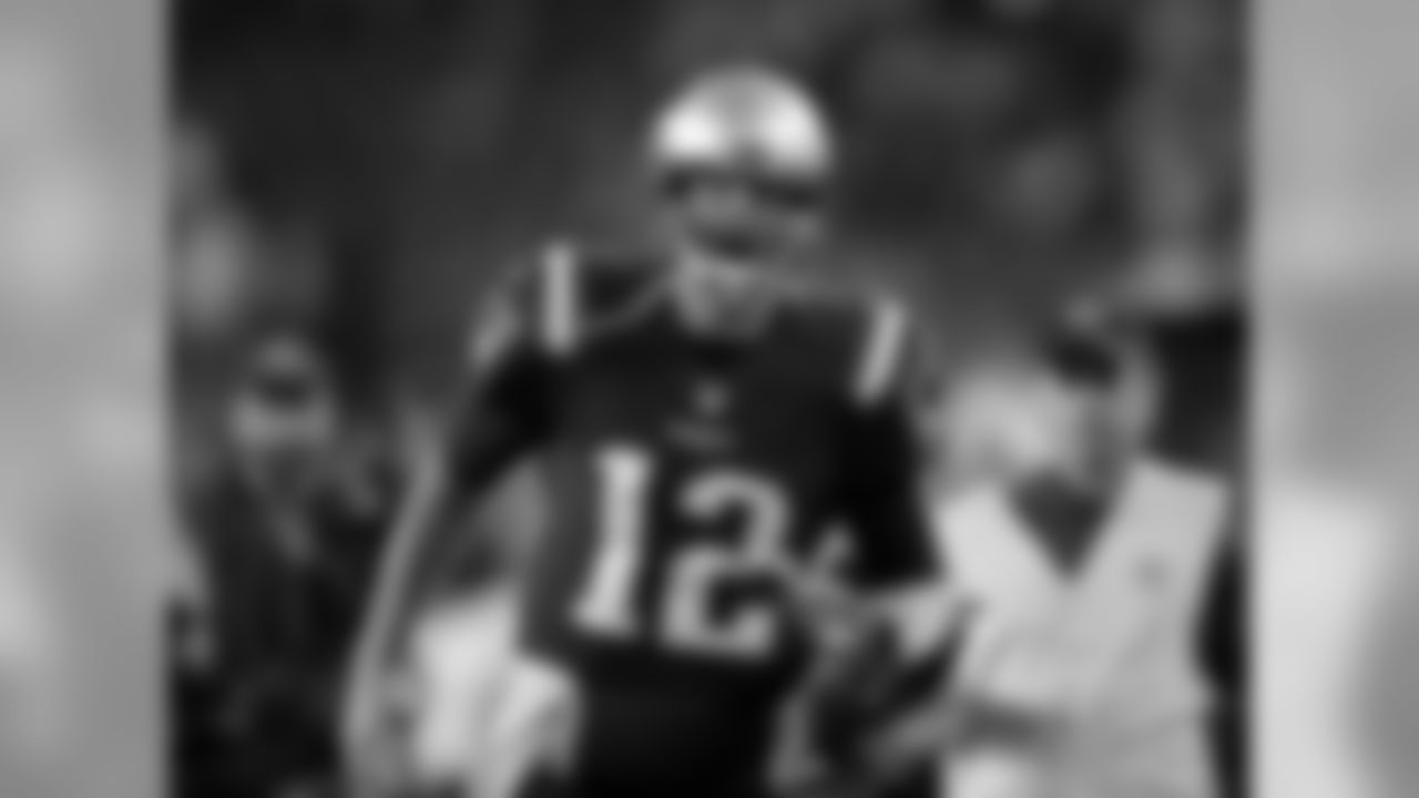New England Patriots quarterback Tom Brady gets pumped up as he runs onto the field before an NFL football game against the Atlanta Falcons, Sunday, Oct. 22, 2017, in Foxborough, Mass. (AP Photo/Charles Krupa)
