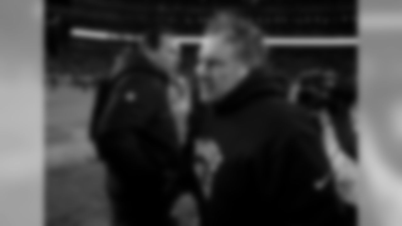 Denver Broncos head coach Gary Kubiak, left, a New England Patriots head coach Bill Belichick met on the field after an NFL football game Sunday, Dec. 18, 2016, in Denver. (AP Photo/Jack Dempsey)