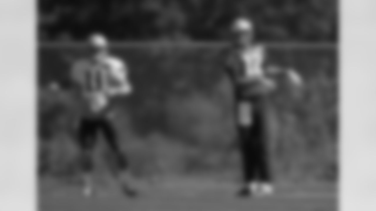 New England Patriots wide receiver Julian Edelman, left, and quarterback Tom Brady, right, warm up at NFL football practice, Wednesday, Sept. 23, 2015, in Foxborough, Mass. (AP Photo/Steven Senne)