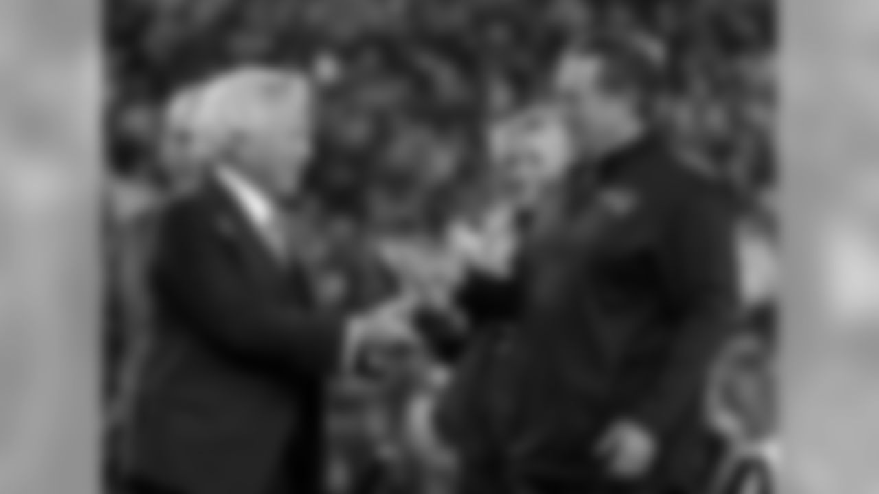 New England Patriots owner Robert Kraft, left, hand the trophy to head coach Bill Belichick after the AFC championship NFL football game against the Jacksonville Jaguars, Sunday, Jan. 21, 2018, in Foxborough, Mass. The Patriots won 24-20. (AP Photo/Winslow Townson)
