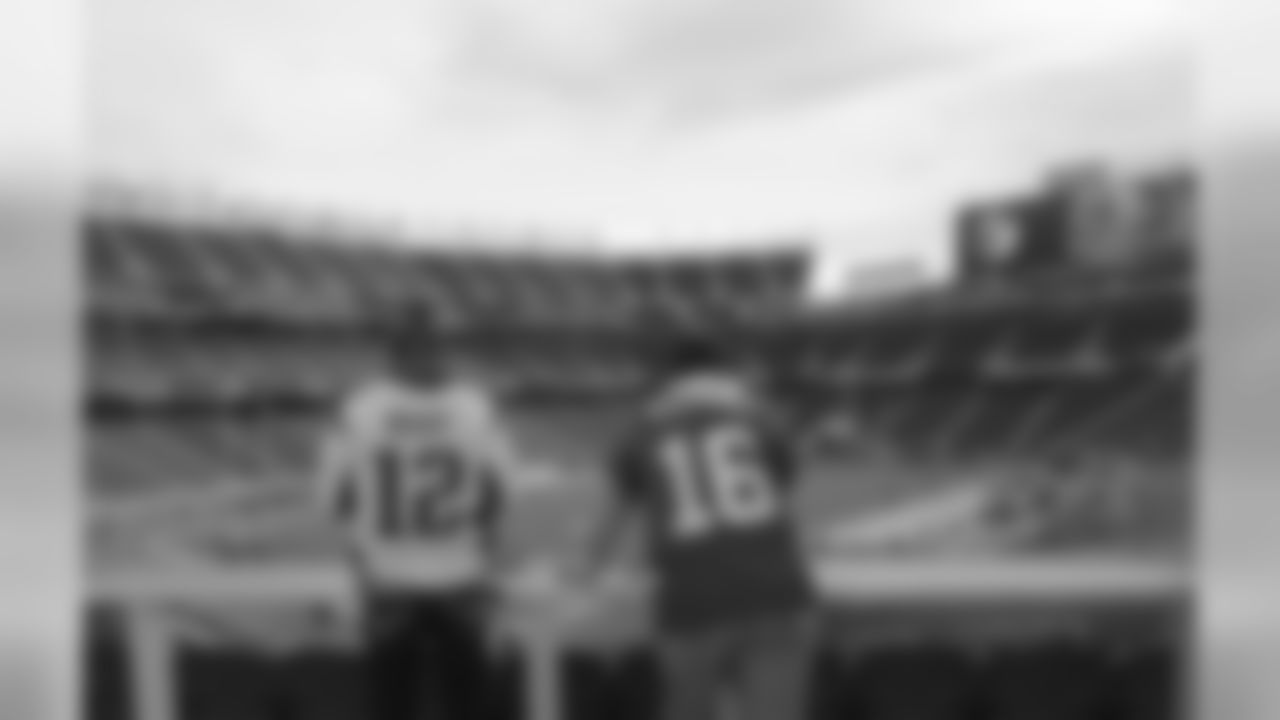 A New England Patriots fan wearing the jersey of quarterback Tom Brady (12) stands next to a San Francisco 49ers fan wearing the jersey of former quarterback Joe Montana inside Levi's Stadium before an NFL football game between the San Francisco 49ers and the New England Patriots in Santa Clara, Calif., Sunday, Nov. 20, 2016. (AP Photo/Jeff Chiu)