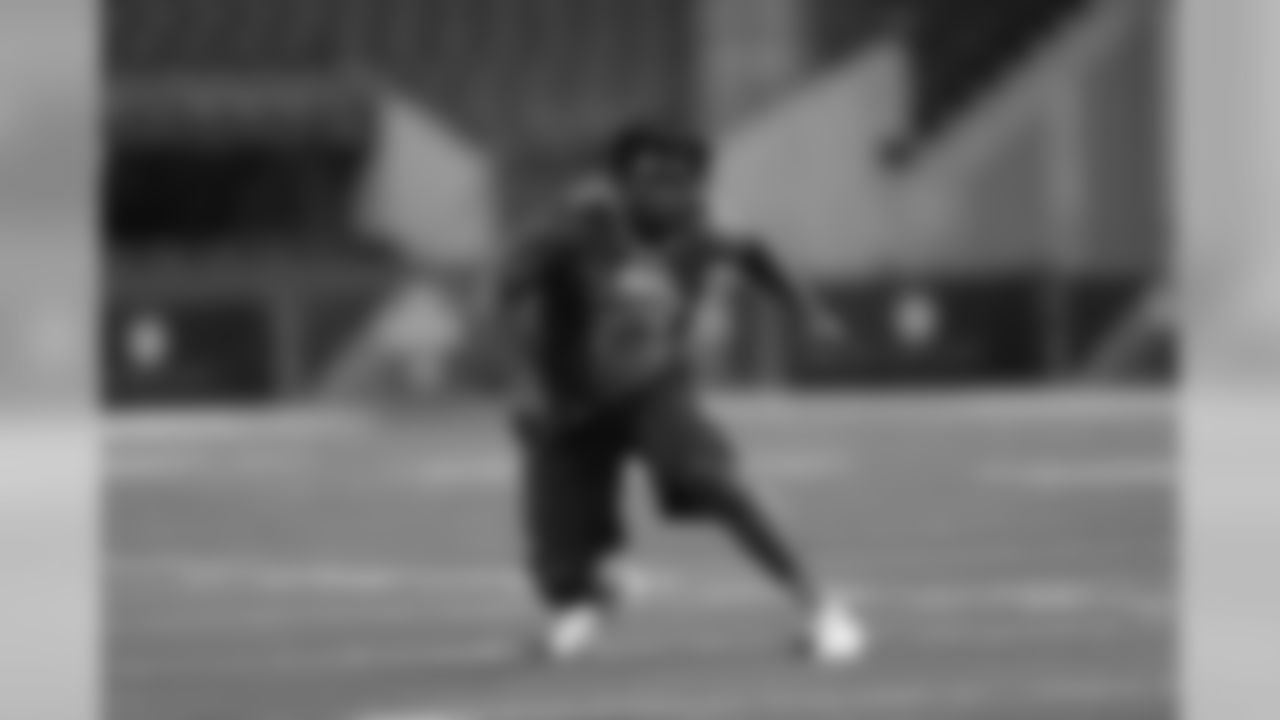 Texas defensive lineman Malcom Brown runs a drill at the NFL football scouting combine in Indianapolis, Sunday, Feb. 22, 2015. (AP Photo/David J. Phillip)