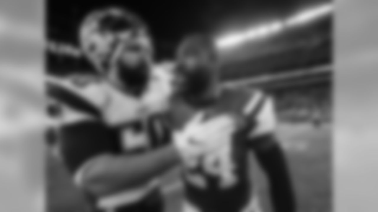 New England Patriots outside linebacker Rob Ninkovich (50) talks with New York Jets cornerback Darrelle Revis (24) after playing in an NFL football game, Sunday, Nov. 27, 2016, in East Rutherford, N.J. (AP Photo/Julio Cortez)